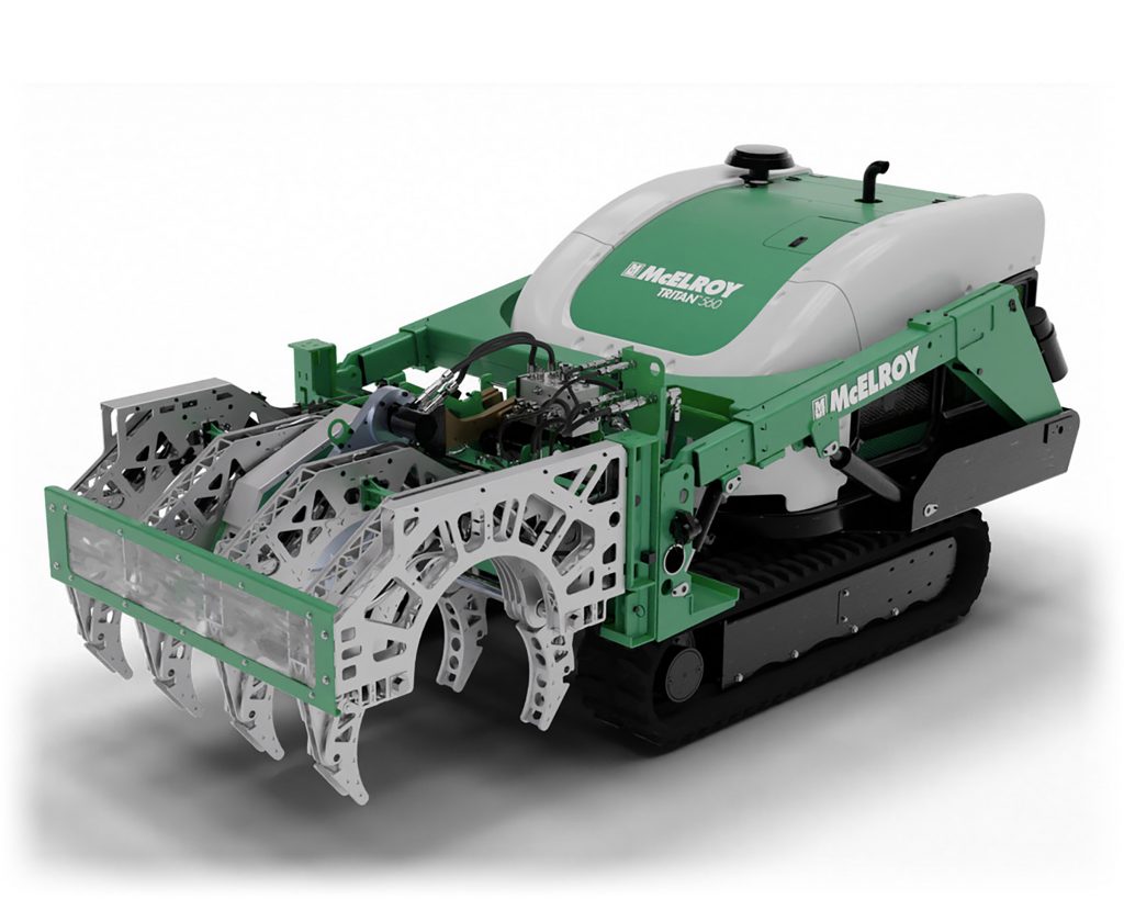 A green and white tracked robotic machine labeled McElroy with mechanical arms and components, designed for industrial or construction use, is shown on a white background.