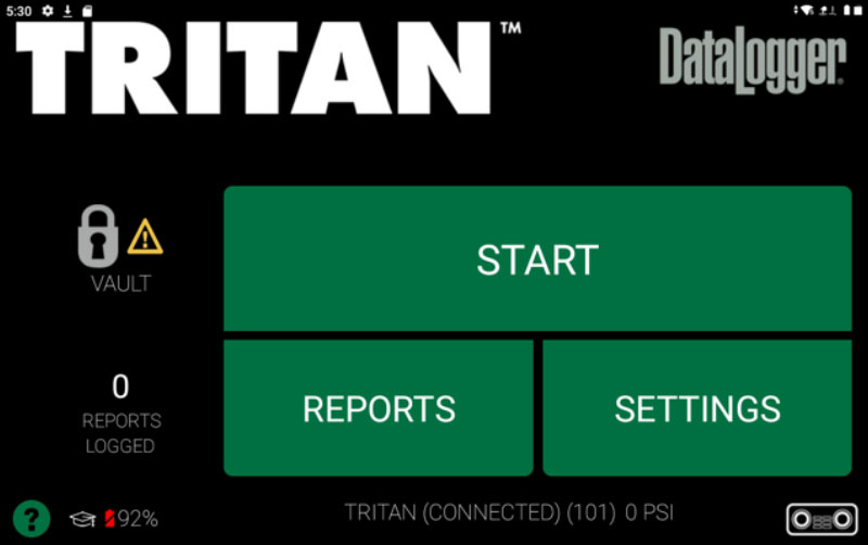 A screenshot of the Tritan DataLogger interface showing large START, REPORTS, and SETTINGS buttons, 0 reports logged, a vault warning icon, and battery at 92%. Status bar and navigation icons are at the bottom.